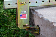 Metal tool with 'Pave Tool' branding on a concrete surface with grass in the background