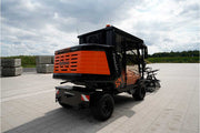 An orange and black S24 PaveJet paver laying machine with a black cabin
