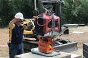 One man using High Flow 200E to lay pavers