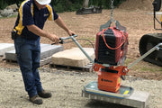 Man using Quick-E-Adjustable Chain & High Flow 200E to lay paver