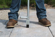 Metal bar with tooth that separates pavers and slabs to straighten the lines while hardscaping