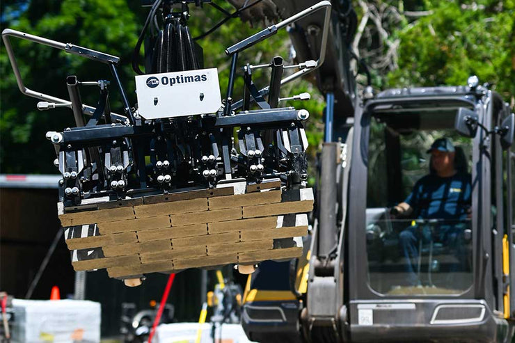 Multi6 Head attaches to an excavator to lift multi pavers at one time for hardscaping